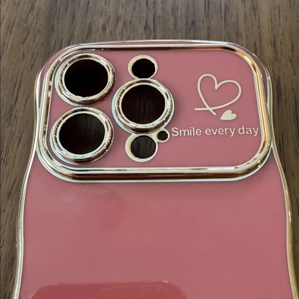 NWOT Faint Red Wave Phone Case for 15 Pro with Gold Trim.